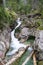 CreekÂ meandering between large rocks